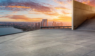 Empty floor and modern city skyline with building at sunset in Suzhou, China. high angle view.