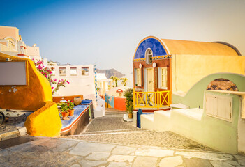 street of Oia town, view of traditional greek village of Santorini, Greece, toned