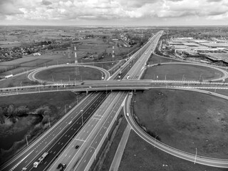 Aerial view of a highway exit in black and white