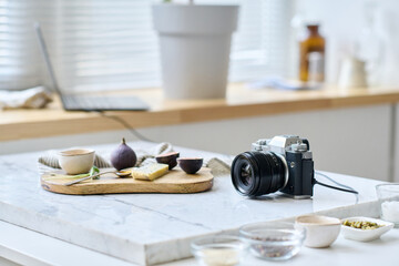 Close-up of tray on table with exotic fruits preparing for professional photo shot with camera