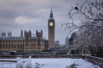 The snow covered Big Ben clocktower at Westminster Bridge, London, England, on a cold winter morning