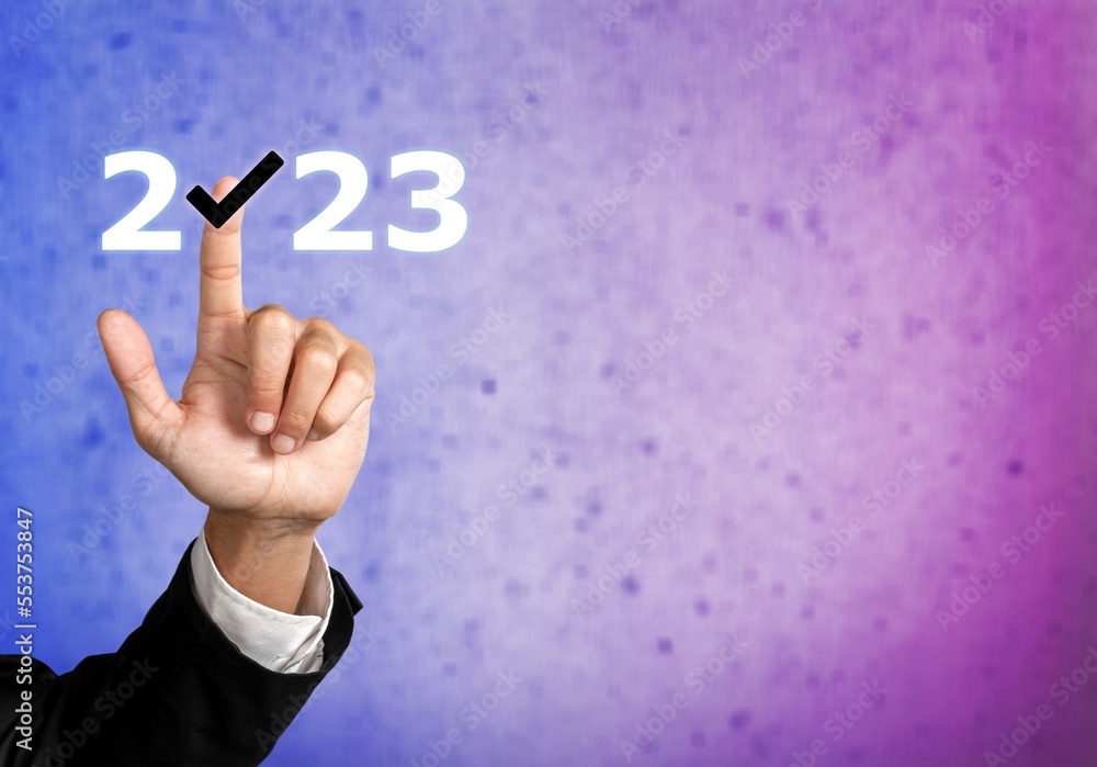 Poster Businessman hand pointing on 2023 icon