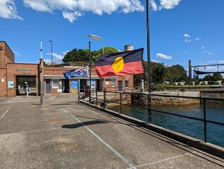 The Aboriginal  flag and the National flag flying at half mast in respect following the death of...