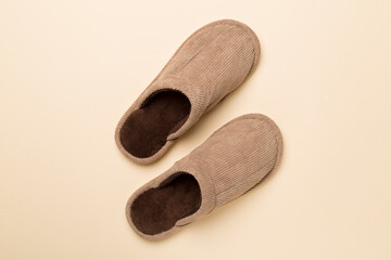 Man's slippers on color background, top view