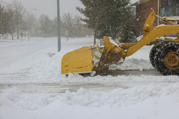 Clearing parking lot and road of snow with truck and moving it to edge of parking lot