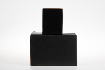 two black boxes square cardboard on white background