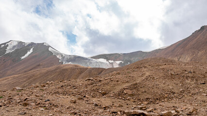 rocky mountain gorge. glaciers in the mountains. stone rocks in the snow. stone plateau