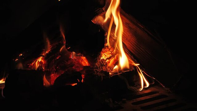 the fire burns in the fireplace close-up