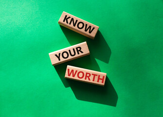 Know your worth symbol. Wooden blocks with words Know your worth. Beautiful green background. Business and Know your worth concept. Copy space.