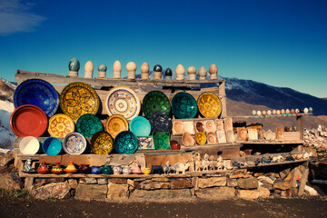 Traditional arabic moroccan handcrafted, colorful decorated plates sold by the road side atlas...