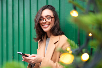 Woman using smartphone Christmas holiday