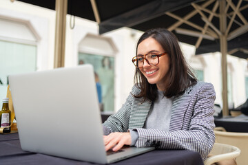 Naklejka na ściany i meble Modern freelancer business woman working use laptop