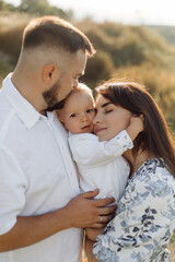 Fototapeta premium Happy young family spend time together outside in green nature