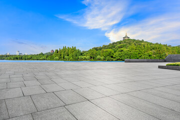 Empty square floor and green mountain natural scenery in Hangzhou, China.