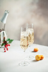 Two glasses of  champagne on light background. Festive drink. Valentins or Christmas concept.