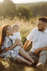 Fototapeta premium Happy young family spend time together outside in green nature
