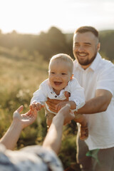 Fototapeta premium Happy young family spend time together outside in green nature
