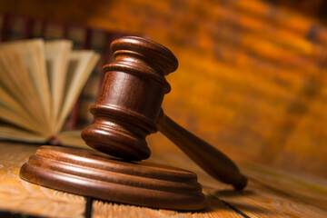 Law and justice concept. Mallet gavel of the judge, scales of justice, books. Copy space for text