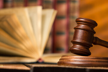 Law and justice concept. Mallet gavel of the judge, scales of justice, books. Copy space for text