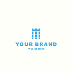 Fototapeta premium M letter logo with a blue crown