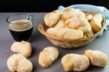 Brazilian Pão de queijo, fresh cheese breads and a hot cup of coffee. Selective focus