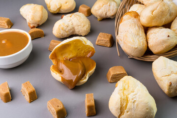 Brazilian Pão de queijo, fresh cheese bread stuffed with dulce de leche. Selective focus
