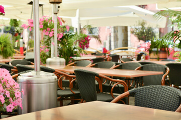 Fototapeta na wymiar Cafe with outdoor terrace, plants and beautiful furniture