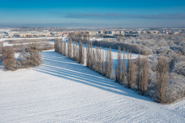 Aerial landscape of the meadow covered with fresh snow, Poland