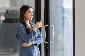 Portrait of Happy Beautiful Business Asian Woman in Office