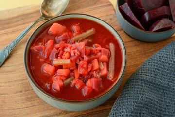 Red beet root soup. Ukrainian beetroot borscht with potatoes, carrots, green beans and pureed tomatoes