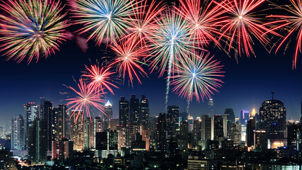 Amazing beautiful colorful fireworks display on celebration night, showing on the city night background	