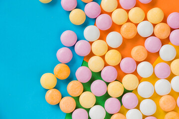 Candy on the colorful background, high angle view