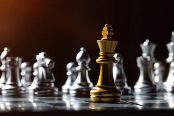 Gold king chess fight on chess board. For business content.