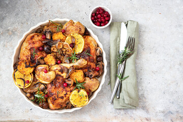 Roast chicken thighs with orange ,vegetables, mushrooms, chestnuts and rosemary 