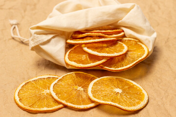 Slices of dried orange in a fabric bag. Close up.