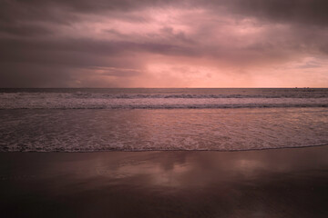 Sunset on the Coronado Beach Series with dramatic cloudscape, rolling waves, and wet reflection on the sand in San Diego, California, USA, tranquil seascape backgrounds