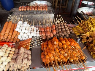 Asian fast junk food at Thailand street. Balls from meat, fish, sea food