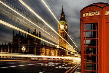 Fototapeta na wymiar London with Big Ben and red Phone Booth during evening in England, UK