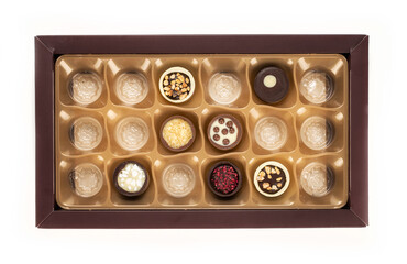 Chocolate temptation with a variety of delicious chocolate candies in a box. Top view.