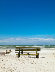 Bench on beach in Stilo, Baltic Sea coast, Poland.