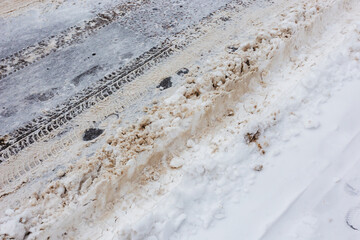 Slush and snow on the roadway after a heavy snowfall without cars