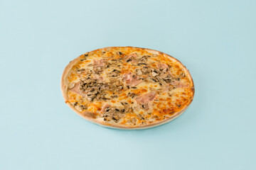 Minimal abstract concept of traditional Italian baked food with whole tasty pizza on isolated pastel blue background. An idea for a restaurant or pizzeria card. Eating a high-calorie fast food meal.