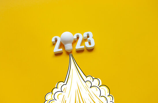New year 2023 Ideas,inspiration concepts with rocket light bulb on yellow background