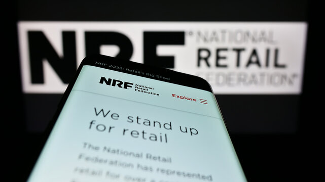 Stuttgart, Germany - 12-02-2022: Mobile phone with website of US trade association National Retail Federation (NRF) on screen in front of logo. Focus on top-left of phone display.