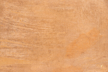 Orange color of grunge concrete textured background with copy space for decoration or use as layer