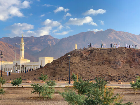  Muslim tourists and pilgrims visiting The Martyrs of Uhud at Mount Uhud during umrah season. Madinah, Saudi Arabia December 01, 2022.