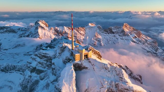Aerial View of the Mountain Santis in the Swiss Alps, Switzerland. Seantis Weather Station, View Platform at sunset.