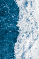 Fototapeta premium Dark blue sea ocean wave and liquid white foam