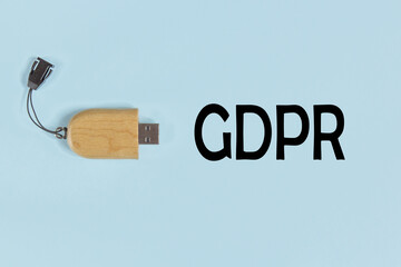 GDPR - Flash drive on blue pastel background