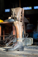 old prosthetic leg displayed in workshop